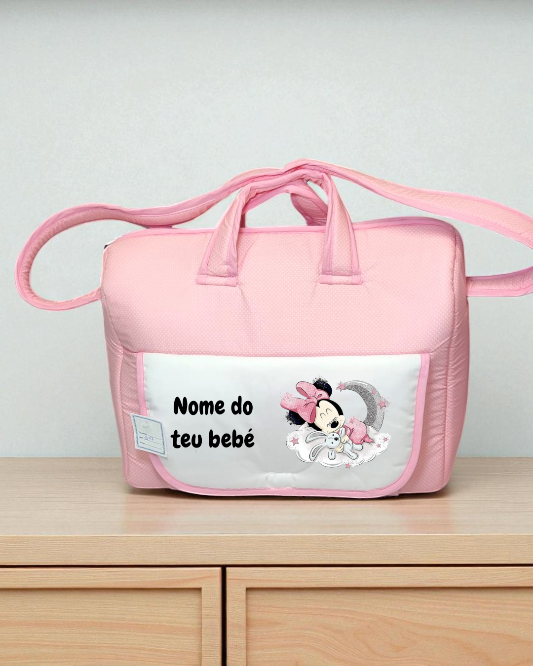 Bolsa de bebé rosa e branca com imagem da Minnie Mouse e texto personalizável