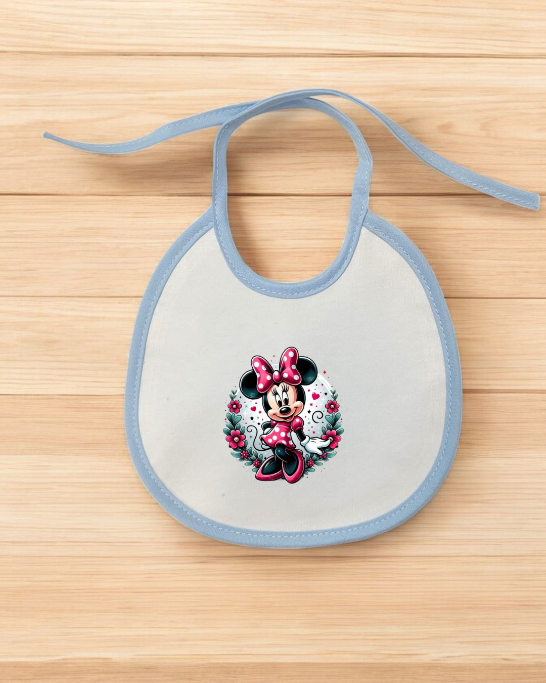 Babete de bebé branco com bordas azuis e imagem da Minnie Mouse colorida