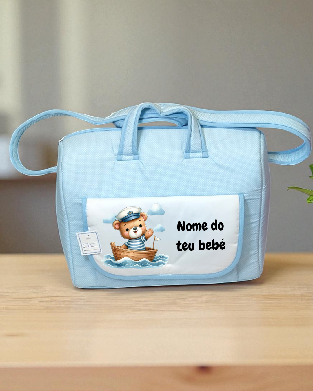 Mala azul para bebé com bolso frontal e desenho de urso marinheiro