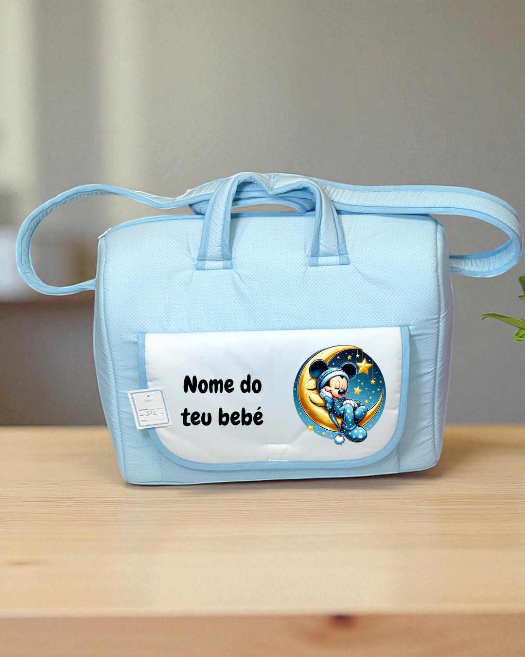 Mala de bebé azul clara com bolso branco e imagem de Mickey Mouse na lua