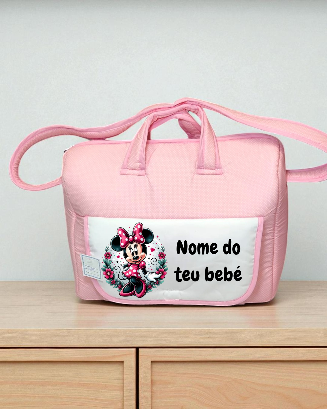 Mala de bebé cor-de-rosa com imagem da personagem Minnie e texto personalizado