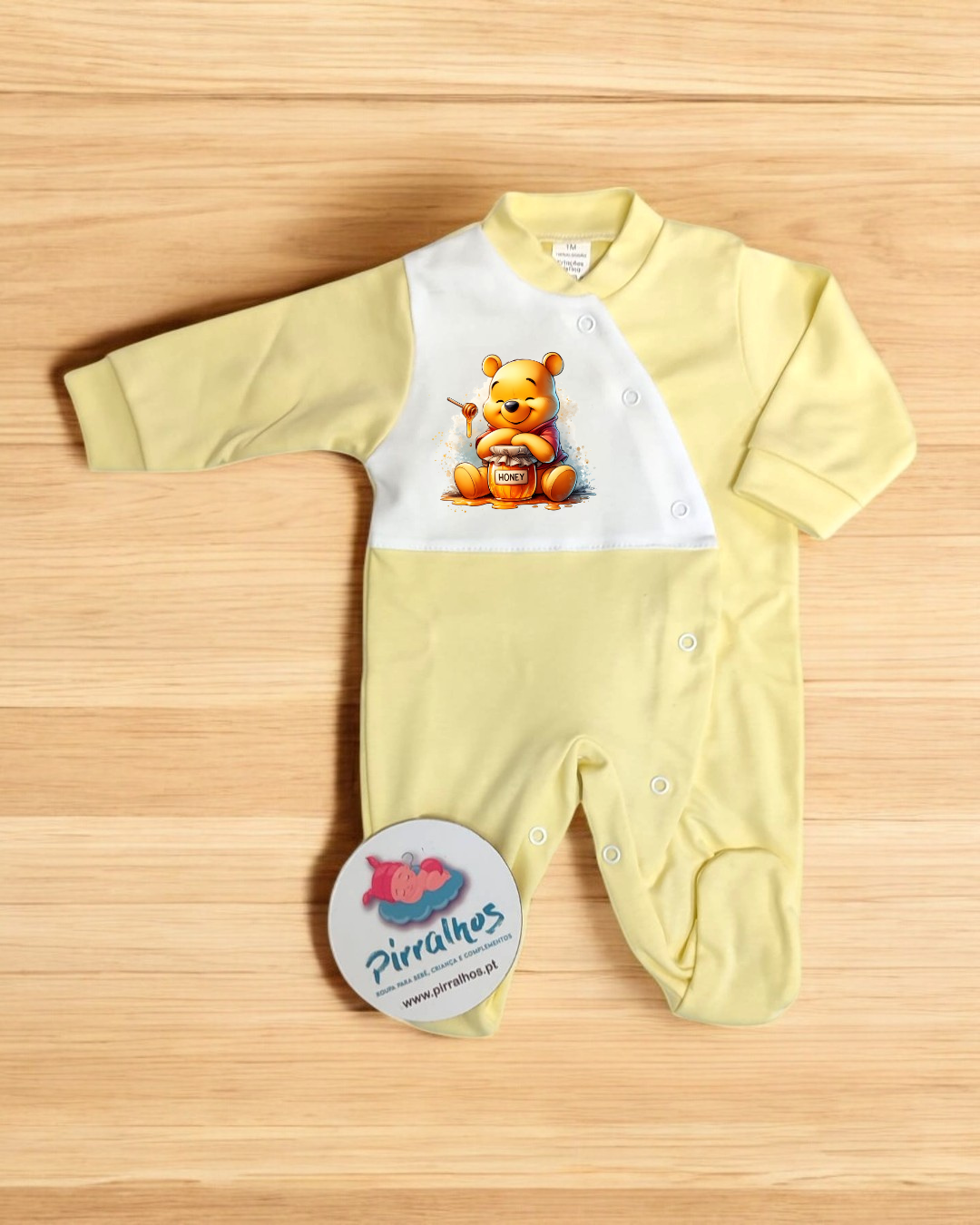 Macacão bebé amarelo e branco com estampado Winnie the Pooh e botões de pressão