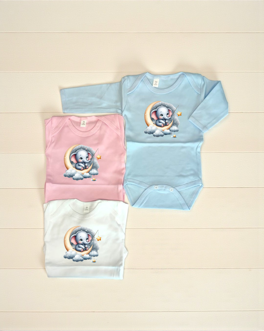 Bodies de bebé azul, rosa e branco com elefante na lua estampado