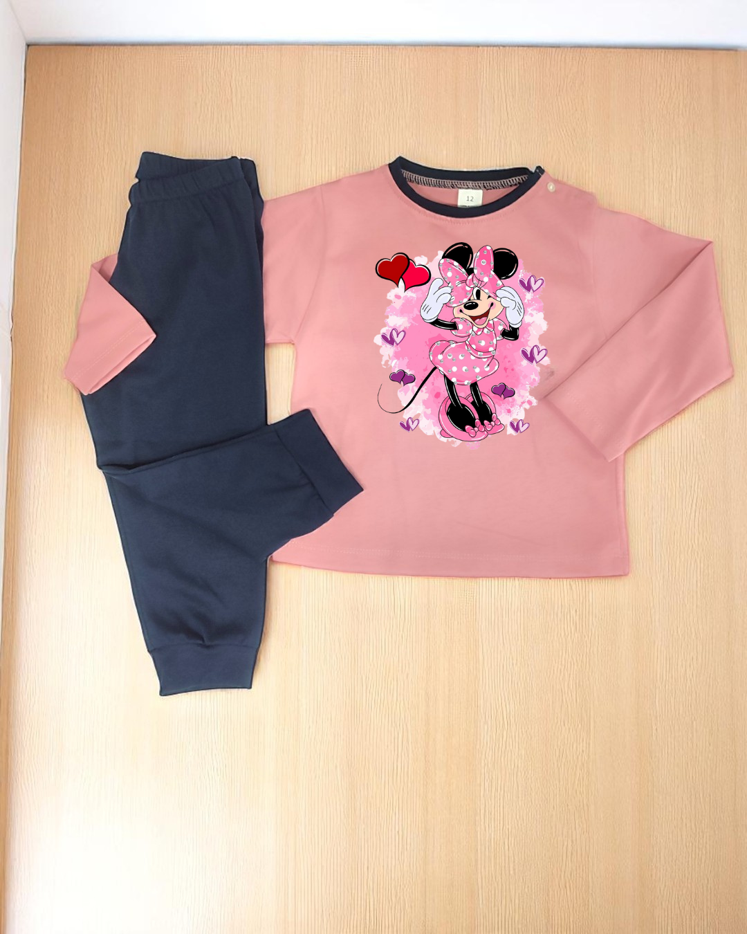 Conjunto infantil rosa com Minnie Mouse e calças azul escuro