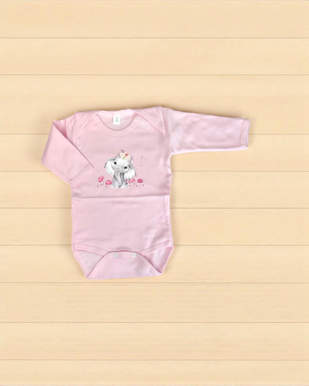 Body de bebé rosa com estampa de elefante com flores.