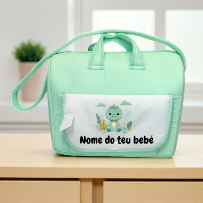 Mala de bebê verde menta com bolso branco e desenho de dinossauro