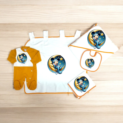 Conjunto de roupa de bebé com macacão amarelo e branco e toalhas com bordas laranja e personagem de desenho animado mágico