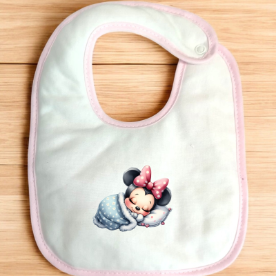 Babete branco com bordas rosa e imagem da Minnie Mouse a dormir