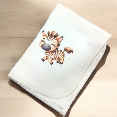 Manta branca com desenho de zebra sorridente
