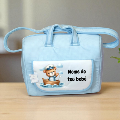 Mala azul para bebé com bolso frontal e desenho de urso marinheiro