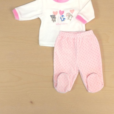 Conjunto bebé com camisola branca e calças cor-de-rosa com padrão de pontos.
