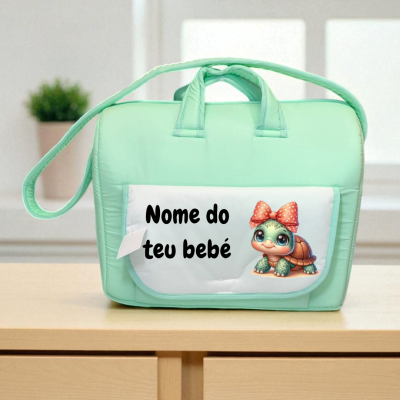 Mala de bebé verde água com bolso branco e desenho de tartaruga