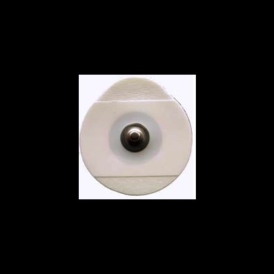 Embalagem redonda branca com peça metálica central sobre superfície bege