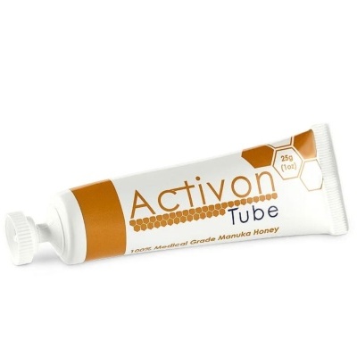 Frasco tubular branco e castanho com texto Activon Tube e embalagem em fundo branco