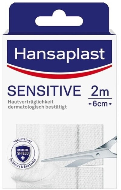 Embalagem Hansaplast Sensitive 2m com tesoura cortando faixa branca