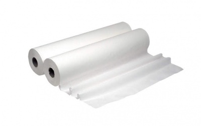 Três rolos grandes de papel branco com textura lisa