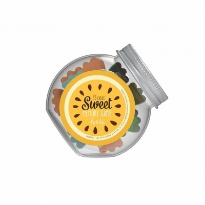 Frasco redondo de biscoitos coloridos com etiqueta amarela e tampa prateada