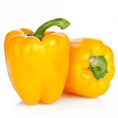 Dois pimentos amarelos frescos com caules verdes