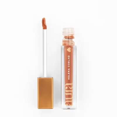 Gloss labial cor de pêssego em embalagem transparente com tampa dourada e texto 'SUS', 'HELENA COELHO' e um coração.