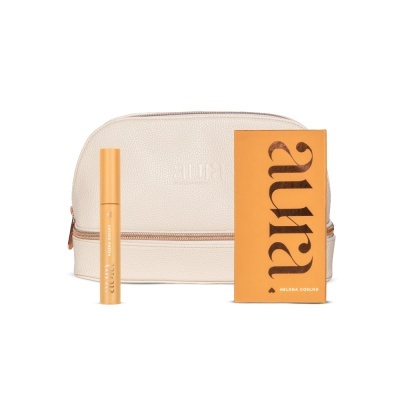 Conjunto com necessaire bege, tubo amarelo claro e caixa amarelo alaranjada com texto Aura