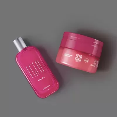 Produtos cosméticos rosa e vermelho sobre fundo cinzento
