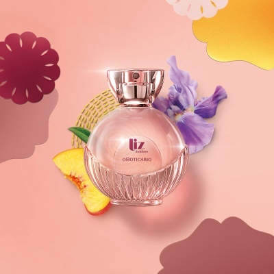 Frasco de perfume rosa Liz Sublime O Boticário com decoração floral e pêssego