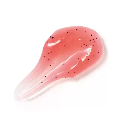 Gota de gel rosado com partículas pretas em fundo branco