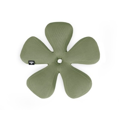 Almofada ergonómica verde em forma de flor com etiqueta preta.
