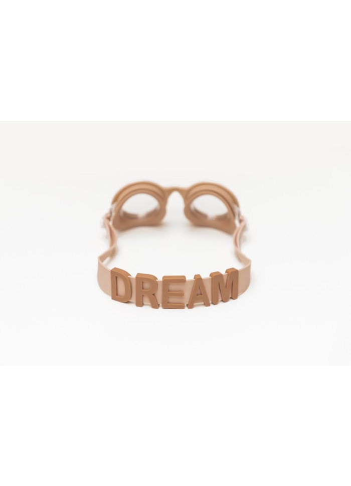 Óculos de natação cor bege com a palavra DREAM