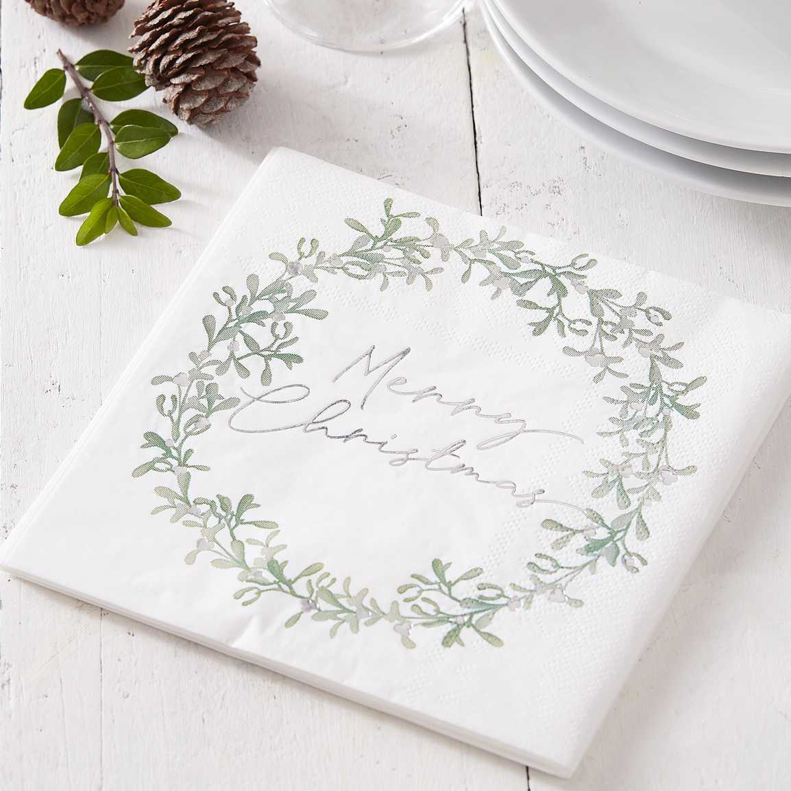Guardanapo de papel branco com estampado verde e texto Merry Christmas