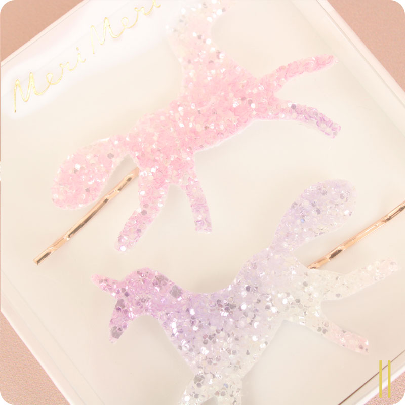 Molhas de cabelo em forma de unicórnios rosa e lilás com glitter em embalagem branca