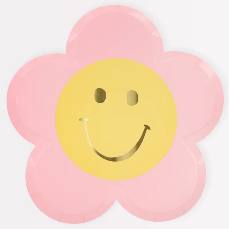 Prato de papel em forma de flor cor-de-rosa com rosto sorridente amarelo