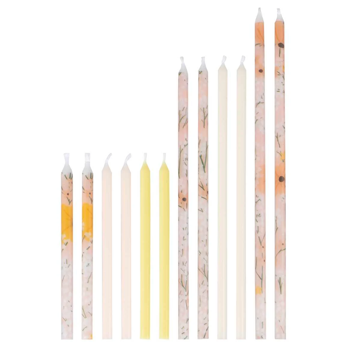 Conjunto de velas finas coloridas e padronizadas em fundo branco