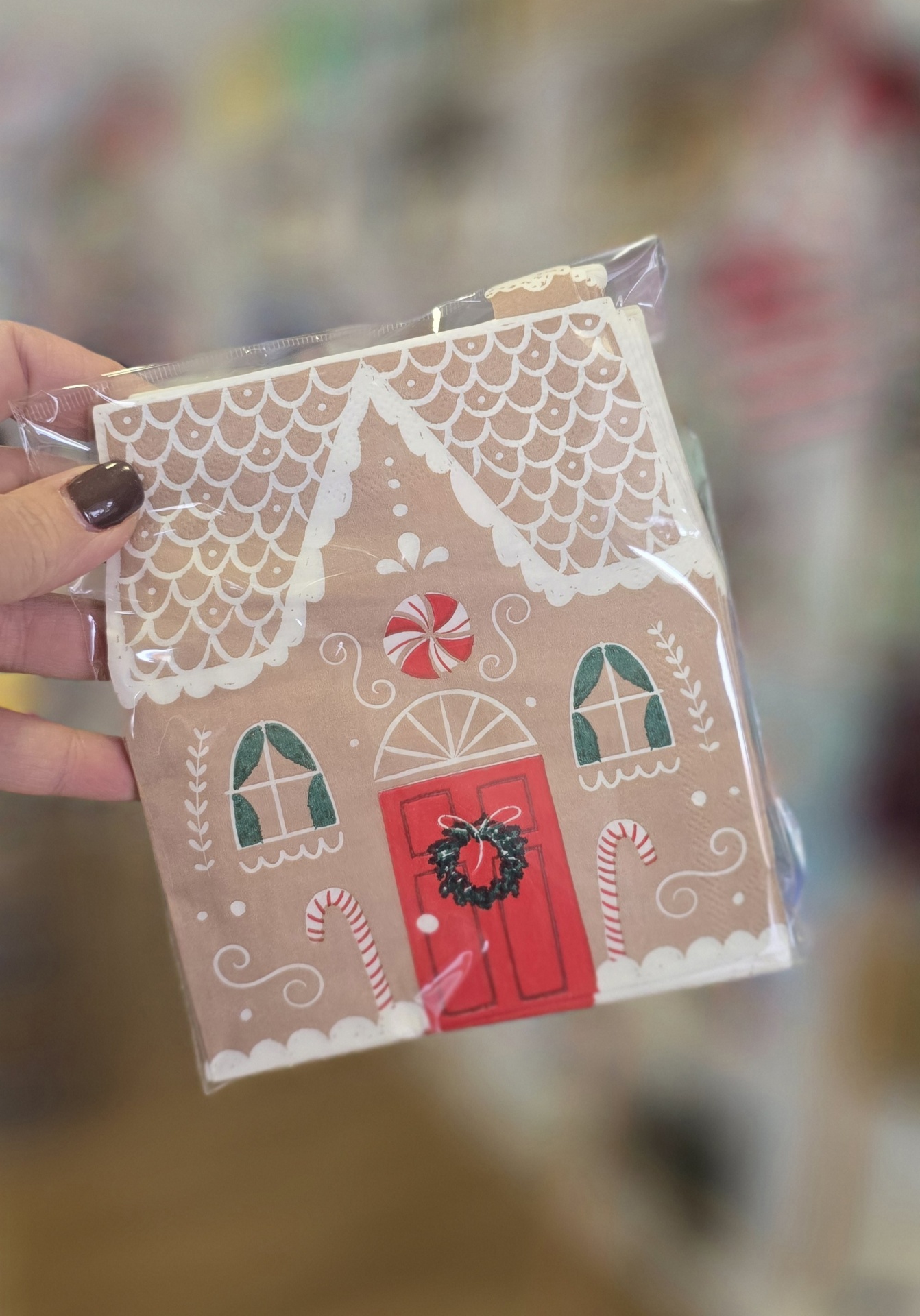 Guardanapo de papel com design de casa de gengibre encarnada e tons de verde