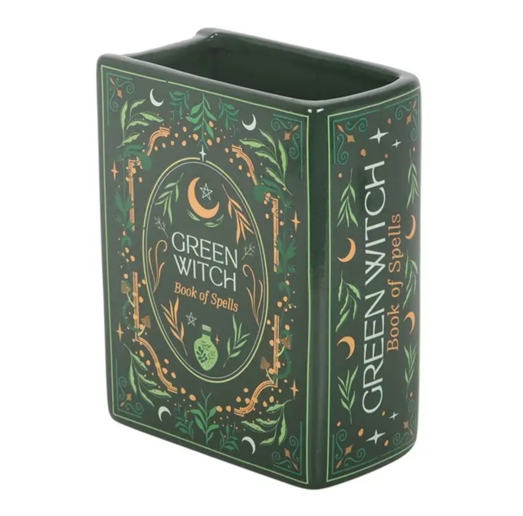 Vaso cerâmico verde com design e texto decorativo
