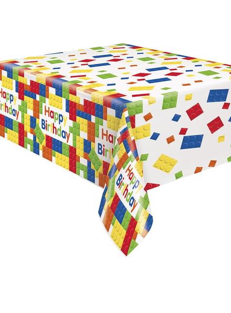 Toalha de mesa colorida com blocos de construção e texto 'Happy Birthday'