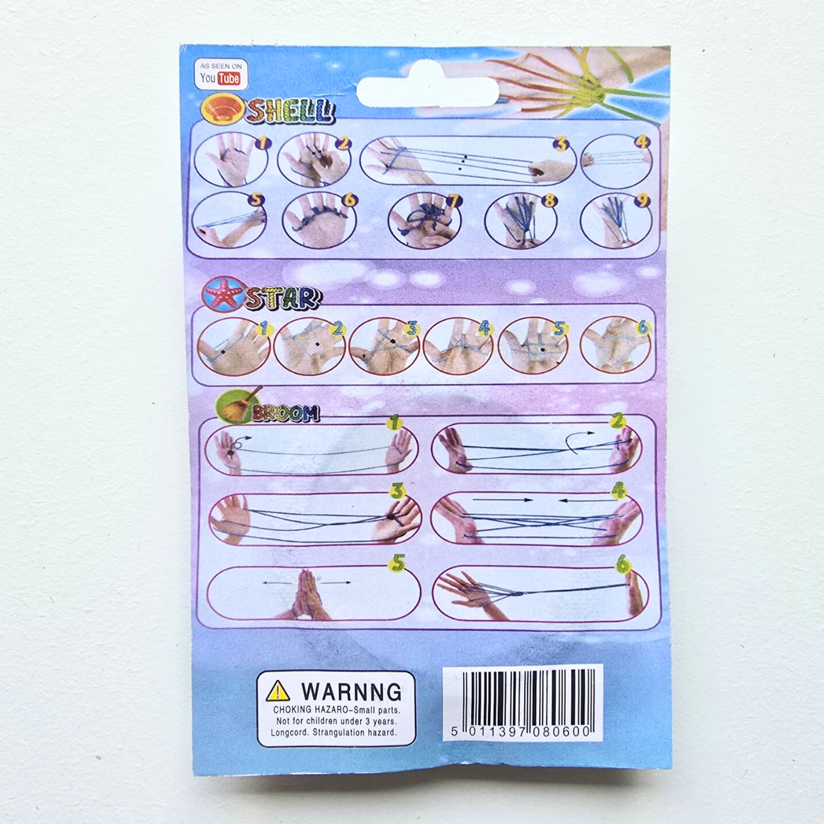 Instruções para jogos com cordas em embalagem de papel azul com texto e ilustrações.