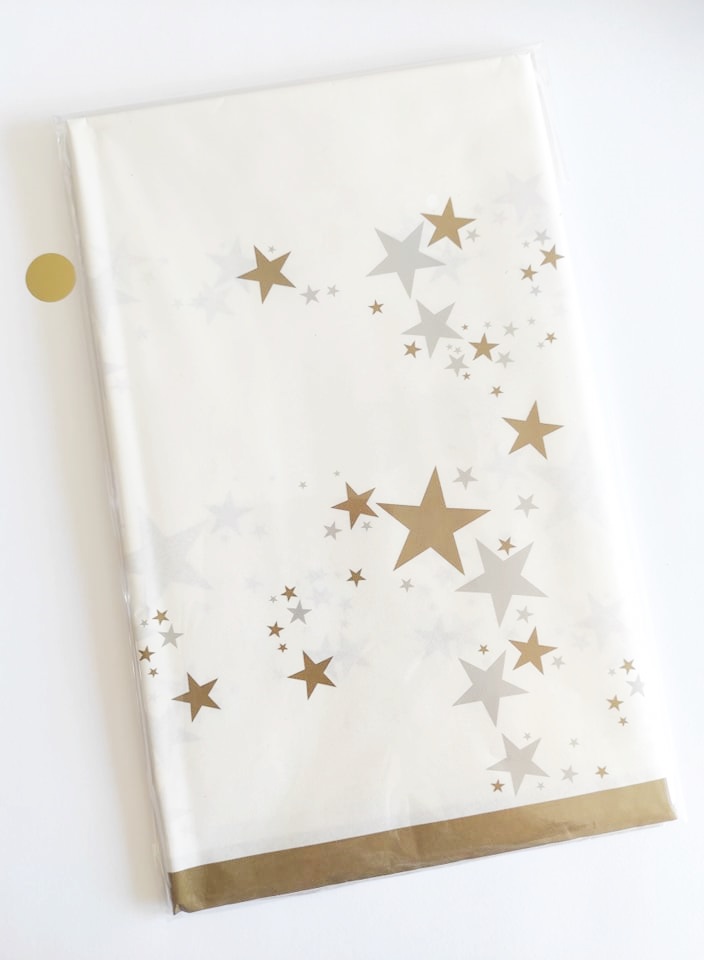Toalha de mesa branca com estrelas douradas e cinza e borda dourada