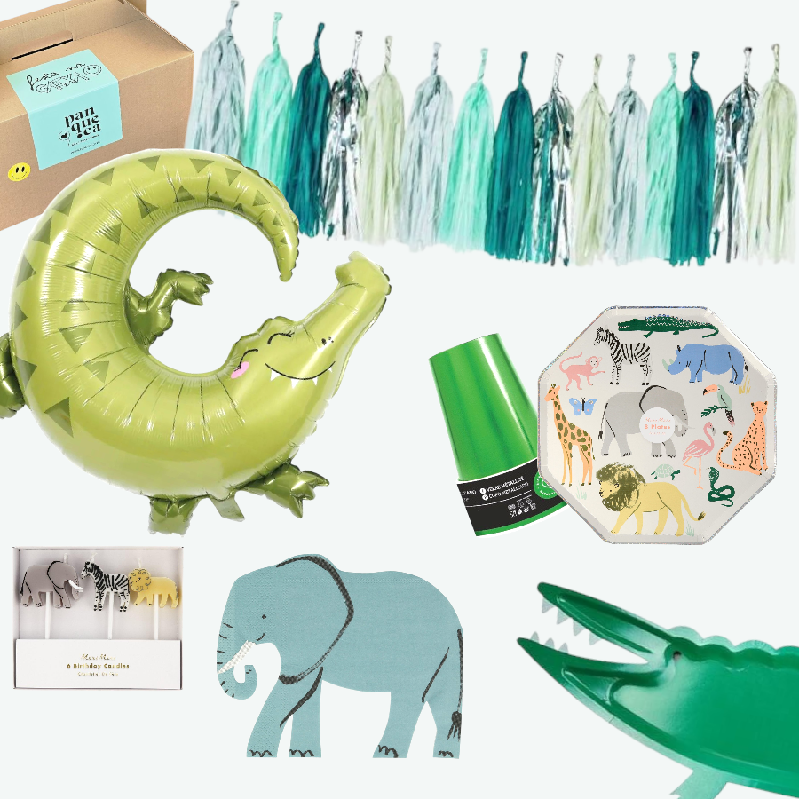 Decoração festiva com balão crocodilo, bandeirolas tassel verdes e azuis, pratos com animais, fita verde e elementos decorativos com animais.