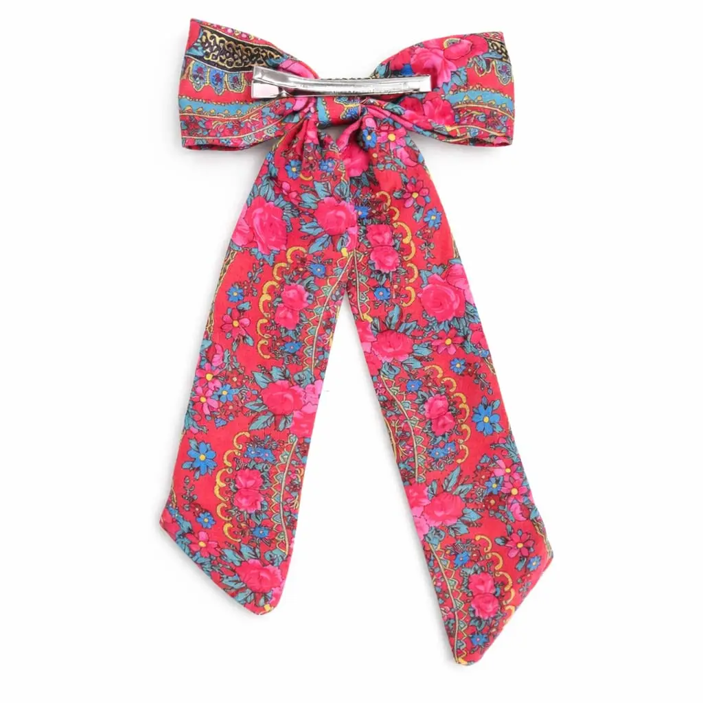 Presilha de cabelo com laço floral vermelho e clipe metálico