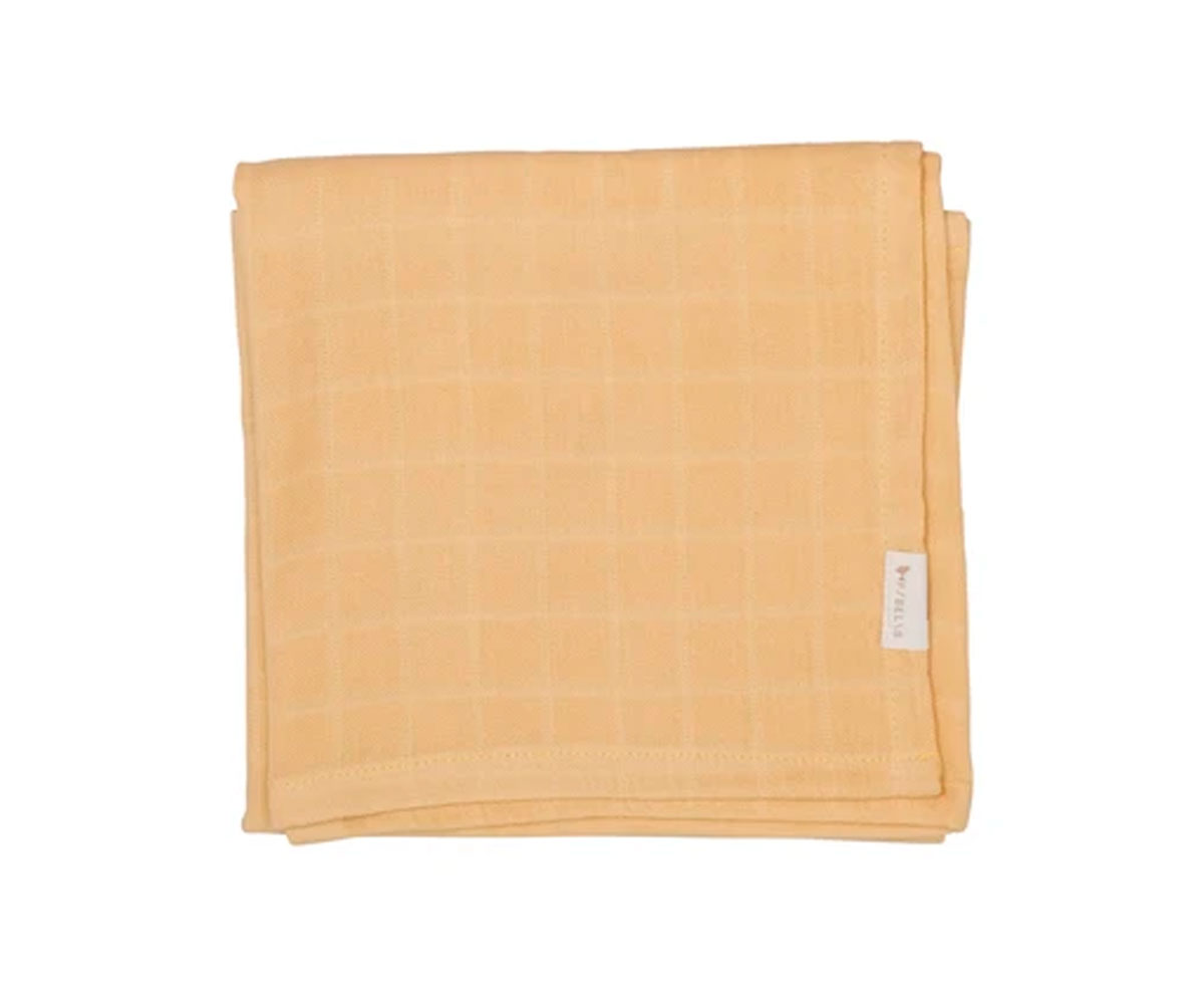 Manta ou toalha amarela clara com padrão quadriculado