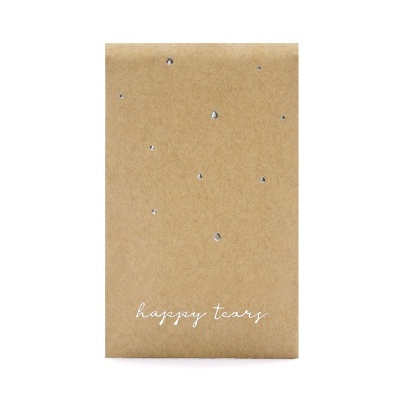 Caixa castanha com pedras brilhantes e texto 'happy tears'