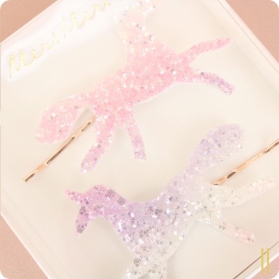 Molhas de cabelo em forma de unicórnios rosa e lilás com glitter em embalagem branca