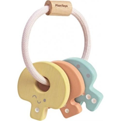 Brinquedo de madeira colorido para bebé com três peças em forma de cogumelos e cordão branco com texto PlanToys