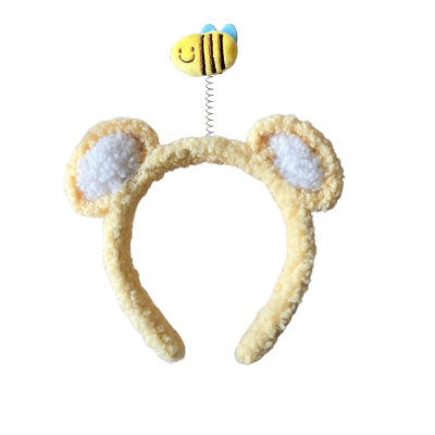Arco de cabelo amarelo com orelhas e abelha numa mola