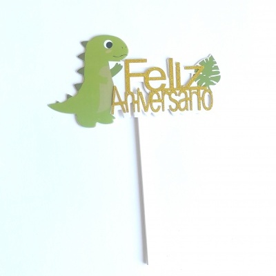 Topo de bolo com dinossauro e texto 'Feliz Aniversário'