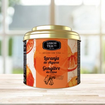 Lata de chá Lisbon Tea Co com rótulo laranja e tampa dourada