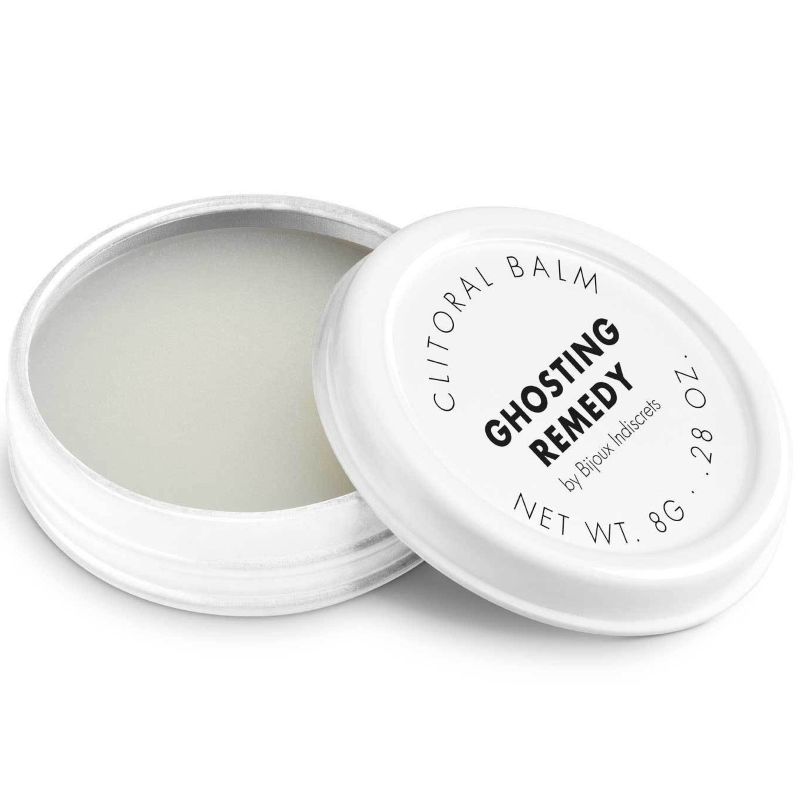 Frasco branco aberto de bálsamo clitoriano Ghosting Remedy com tampa com texto