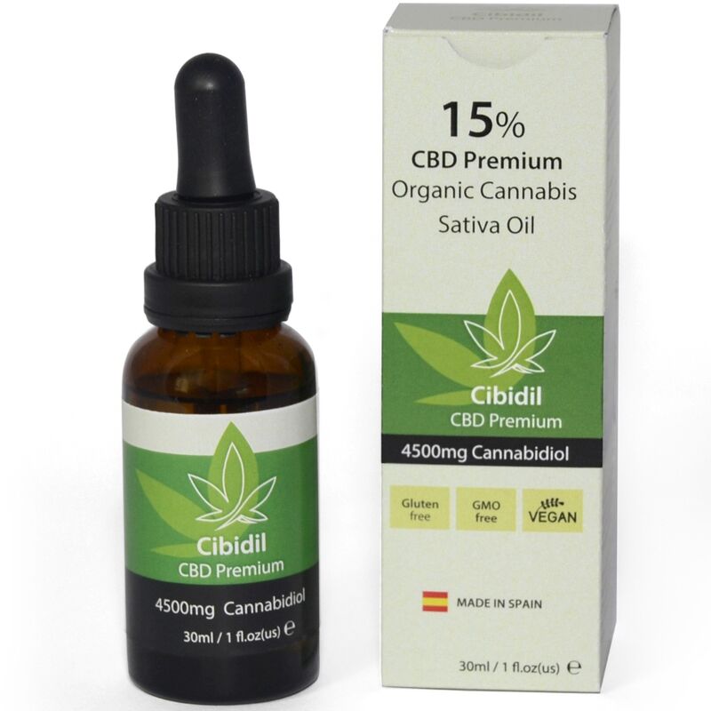 Frasco âmbar com óleo de cannabis e embalagem branca e verde