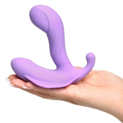 Produto anatómico lilás em silicone na mão, fundo branco.